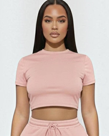 Calla Lily Cosmetics + CL kids pink cotton blend crop tee and drawstring shorts set on a model.