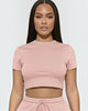 Calla Lily Cosmetics + CL kids pink cotton blend crop tee and drawstring shorts set on a model.