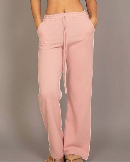 Calla Lily Cosmetics + CL kids pink cotton French terry crop top with elastic hem and wide-leg pants.