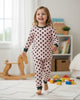 Calla Lily Cosmetics + CL kids pink thermal pajama set with black polka dots, long sleeves, and cuffed ankles. 60% Cotton 40% Polyester.
