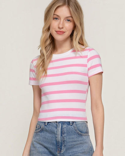 Model wearing a Calla Lily Cosmetics + CL kids pink and white striped short sleeve cotton crop top with crew neck.