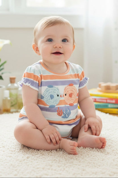 Calla Lily Cosmetics + CL kids pastel striped cotton bodysuit with two pufferfish graphic and ruffled sleeves.