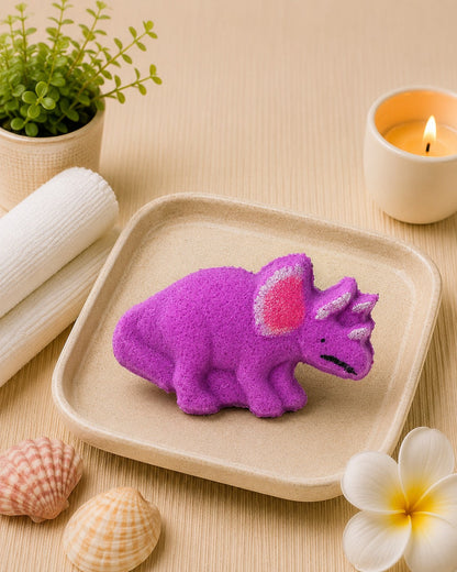 Calla Lily Cosmetics + CL kids purple Triceratops dinosaur bath bomb with grape scent, enriched with coconut oil.