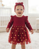 Calla Lily Cosmetics + CL kids red baby dress with gold polka dots and matching headband. Long sleeves, polyester-spandex blend.