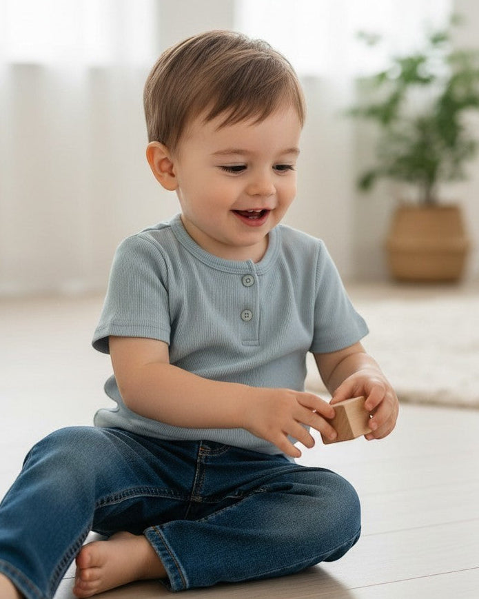 Calla Lily Cosmetics + CL kids three ribbed baby tees in blue, taupe, and cream with button plackets.