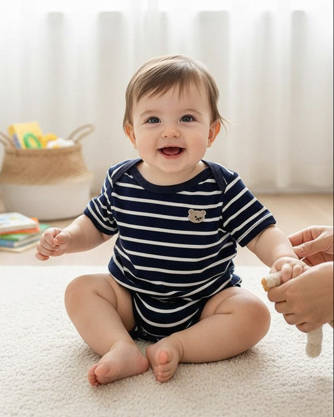 Calla Lily Cosmetics + CL kids navy and white striped cotton spandex baby romper with embroidered bear detail.