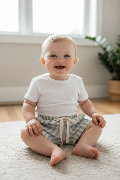 Calla Lily Cosmetics + CL kids light blue and white striped 100% cotton baby shorts with drawstring waist and button detail.