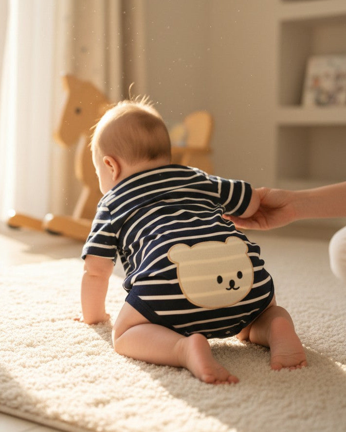 Calla Lily Cosmetics + CL kids navy and white striped baby romper with embroidered bear detail. 95% cotton.