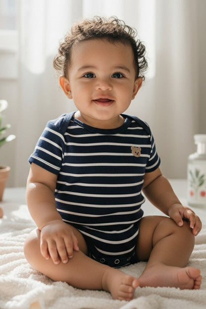 Calla Lily Cosmetics + CL kids navy and white striped short-sleeve bodysuit with teddy bear detail. 95% Cotton, 5% Elastine.
