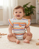 Calla Lily Cosmetics + CL kids striped cotton bodysuit with ruffled sleeves and a smiling octopus pocket detail.