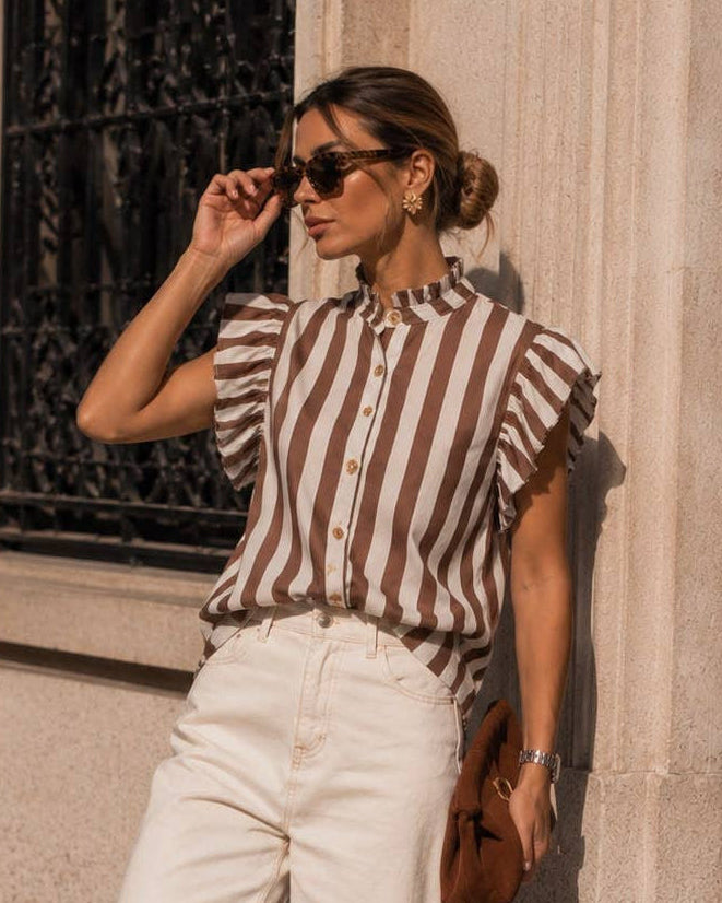 Calla Lily Cosmetics + CL kids striped cotton shirt with ruffled shoulders, stand-up collar, and wood-effect buttons.