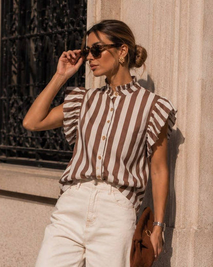 Calla Lily Cosmetics + CL kids striped cotton shirt with ruffled shoulders, stand-up collar, and wood-effect buttons.