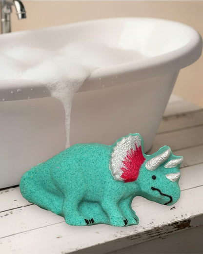Calla Lily Cosmetics + CL kids teal triceratops dinosaur bath bomb with silver and red accents