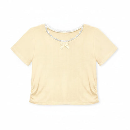 Calla Lily Cosmetics + CL kids toddler yellow ribbed knit top with lace trim and bow, paired with blue chambray shorts.