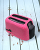 Calla Lily Cosmetics + CL kids pink toaster-shaped bath bomb with strawberry scent on a white wooden surface