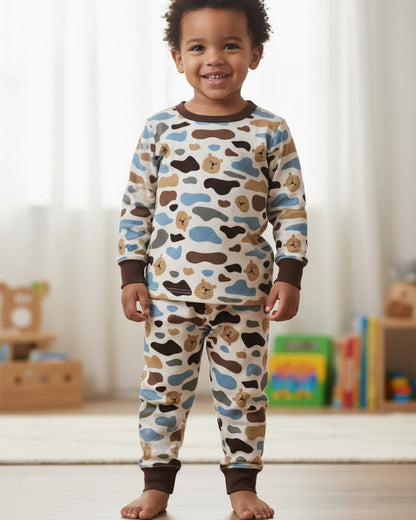 CL kids Camo Bear Thermal PJ Set with brown trim. Features a white base with a camouflage pattern in blue, brown, and tan, interspersed with small bear faces. Made of cotton and polyester blend.