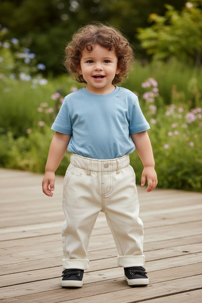 CL kids elastic waist baby jeans in winter white, made from 85% cotton. Features rolled cuffs and a comfortable fit.