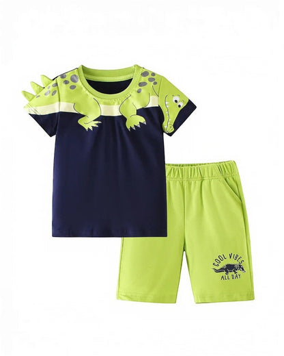 Children's outfit with dinosaur-themed shirt and shorts on a white background