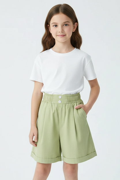 Light green shorts on a white background with a book and glasses in the corner.