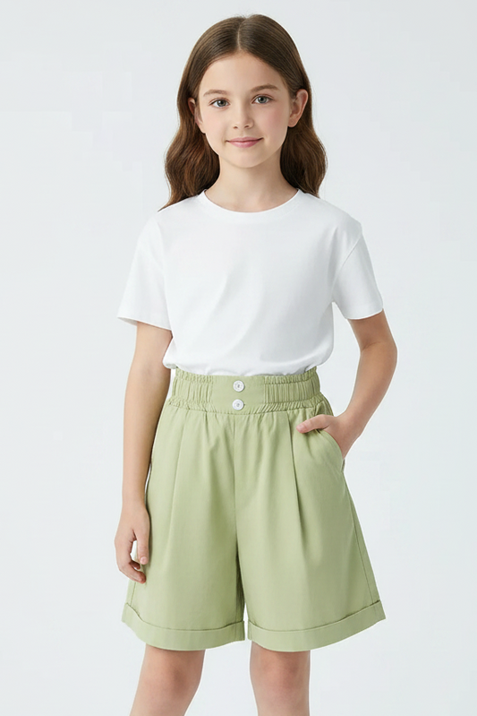 Light green shorts on a white background with a book and glasses in the corner.