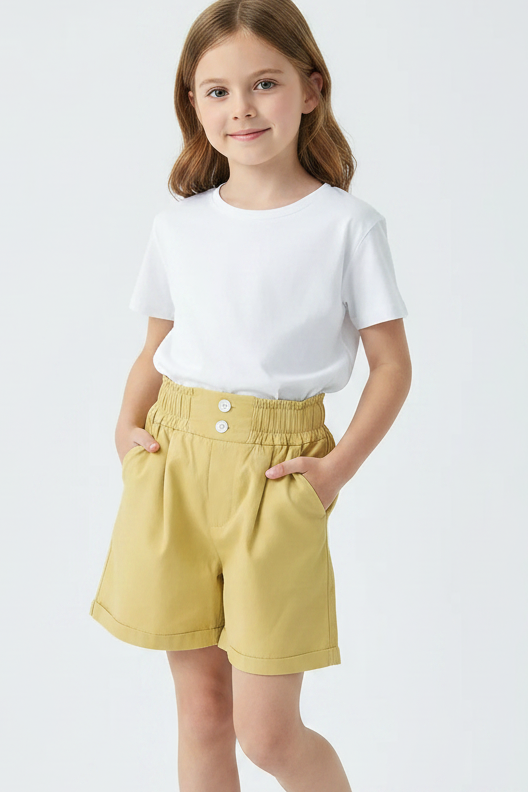 Beige shorts on a light gray background with a book and glasses in the corner.