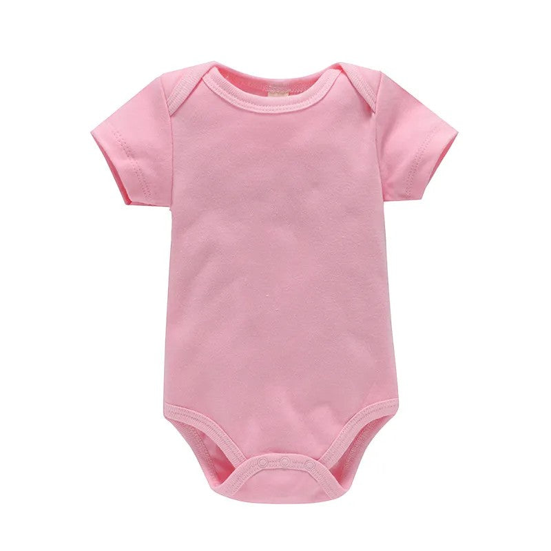 Pink baby onesie on a white background