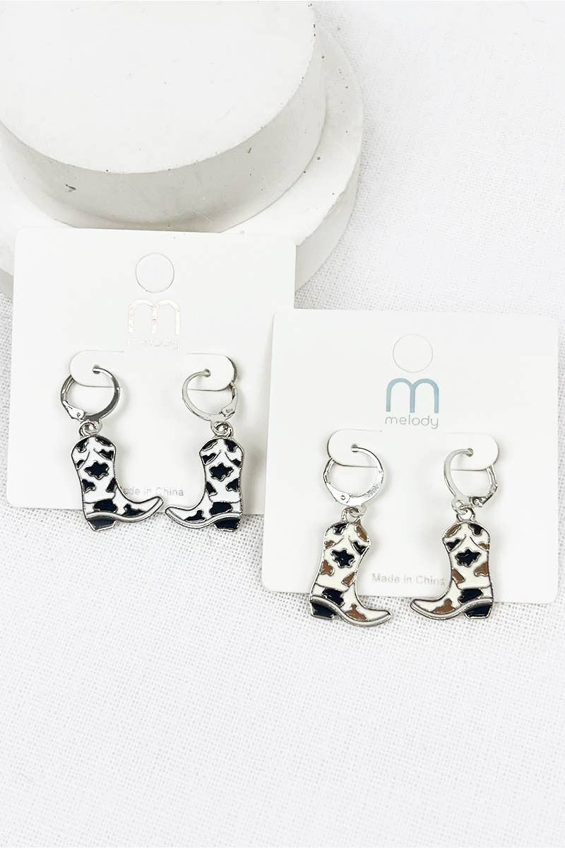 Cowboy boot earrings on a white card with a brand logo.