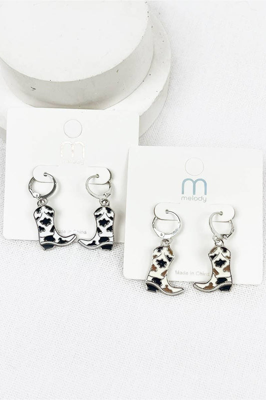 Cowboy boot earrings on a white card with a brand logo.