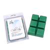 Green wax melts in a packaging on a marble surface