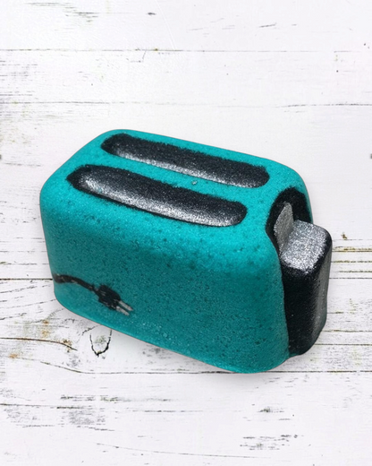 Calla Lily Cosmetics + CL kids teal toaster-shaped bath bomb with floral scent and skin-loving coconut oil