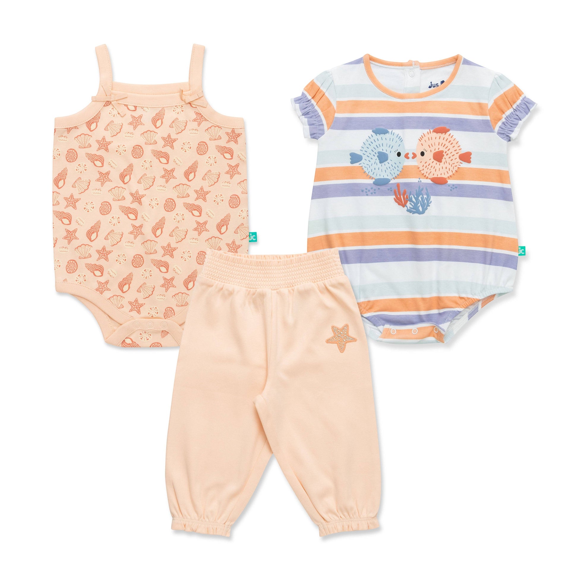 Set of baby clothing including a onesie, tank top, and pants on a white background