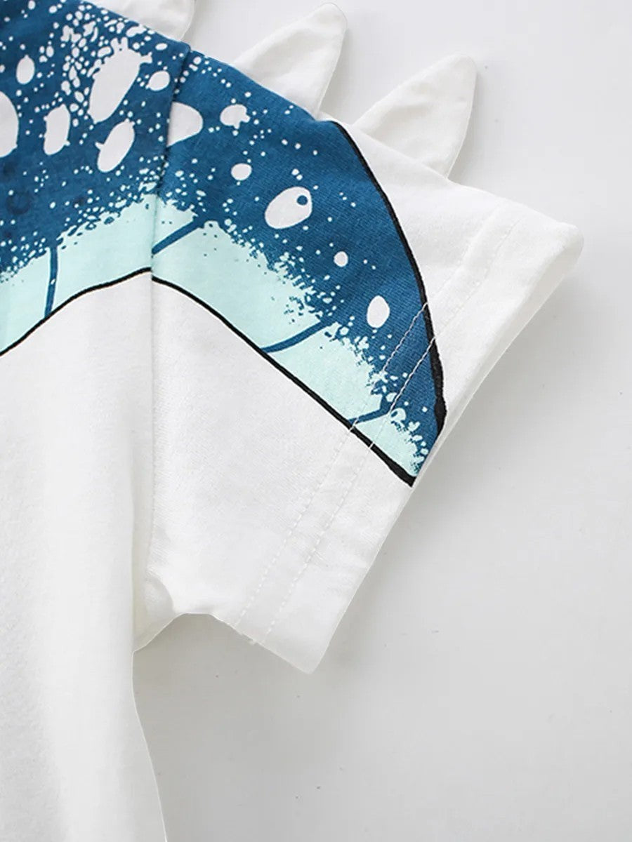 Close-up of a white shirt with blue abstract design on a light gray background