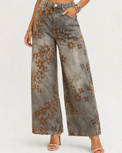 Wide-leg jeans with floral pattern worn by a person on a white background