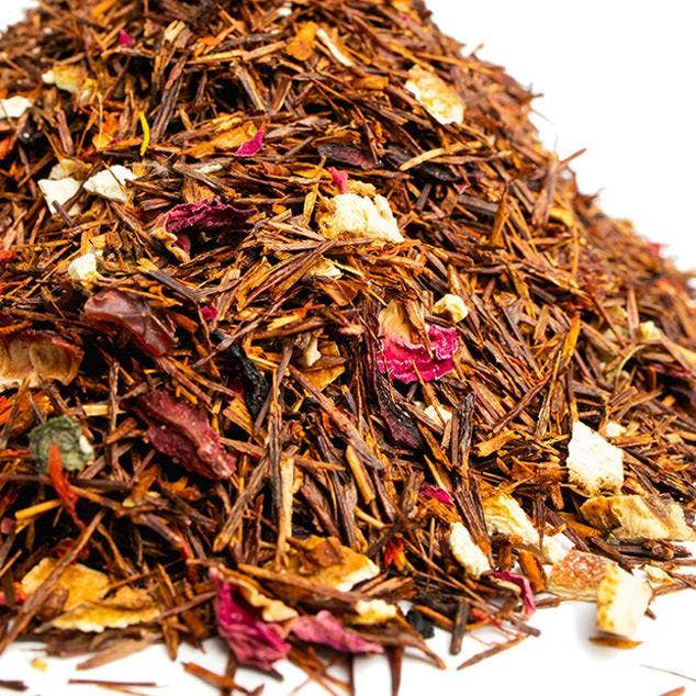 Heap of mixed dried herbs and flowers on a white background