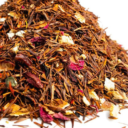 Heap of mixed dried herbs and flowers on a white background
