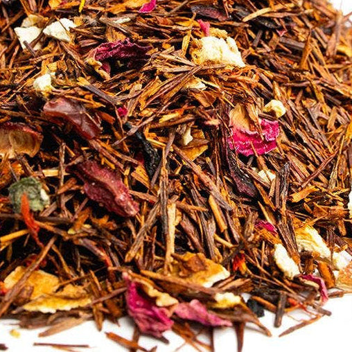 Heap of mixed dried herbs and flowers on a white background