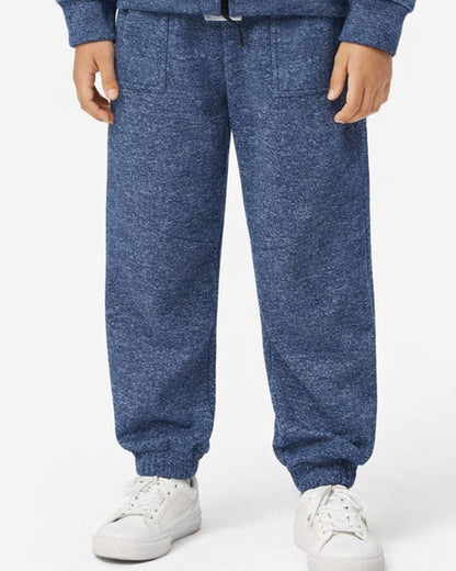 A child wearing a heathered blue zip-up hoodie and matching jogger pants with white sneakers, shown from the chest down against a plain light background.