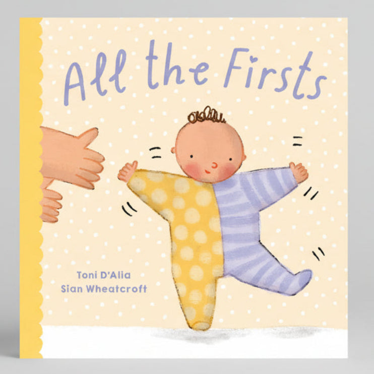 Book cover of 'All the Firsts' with a baby and adult hand illustration on a polka dot background.