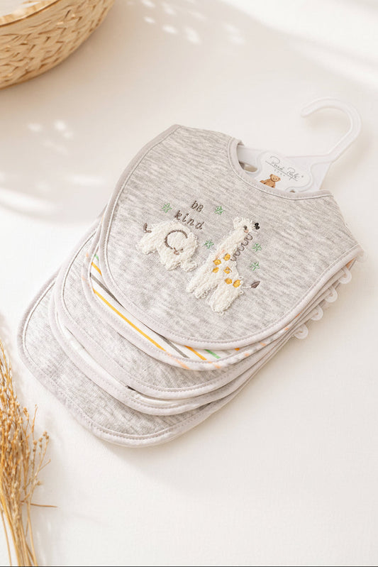 Stack of gray baby bibs with embroidered designs on a white surface