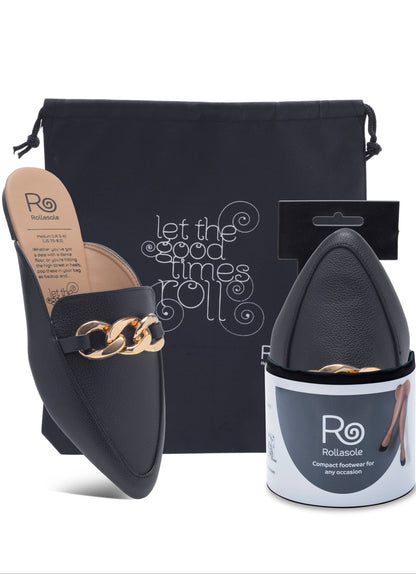 Black slip-on shoes with gold chain detail, black pouch, and white container with 'Ro' branding on a white background.