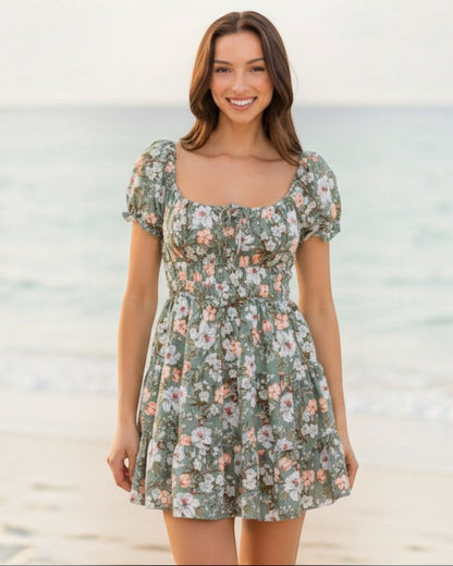 Woman wearing a floral dress against a plain background