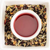 Tea leaves and a cup of tea on a white background