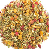 A circular pile of loose-leaf herbal tea blend on a solid white background, featuring dried green leaves, yellow-orange citrus pieces, and pink dried fruit.