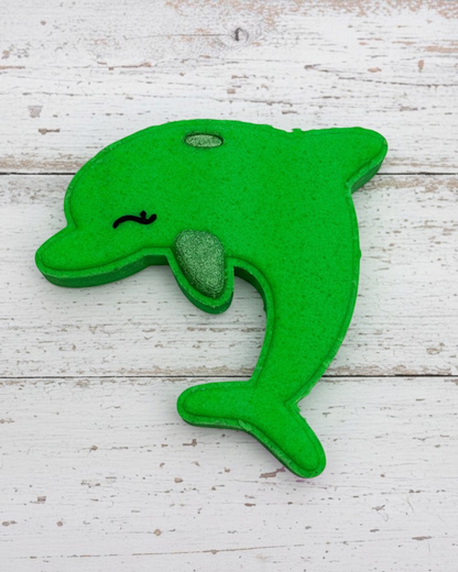 Green dolphin-shaped object on a white background