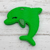 Green dolphin-shaped object on a white background