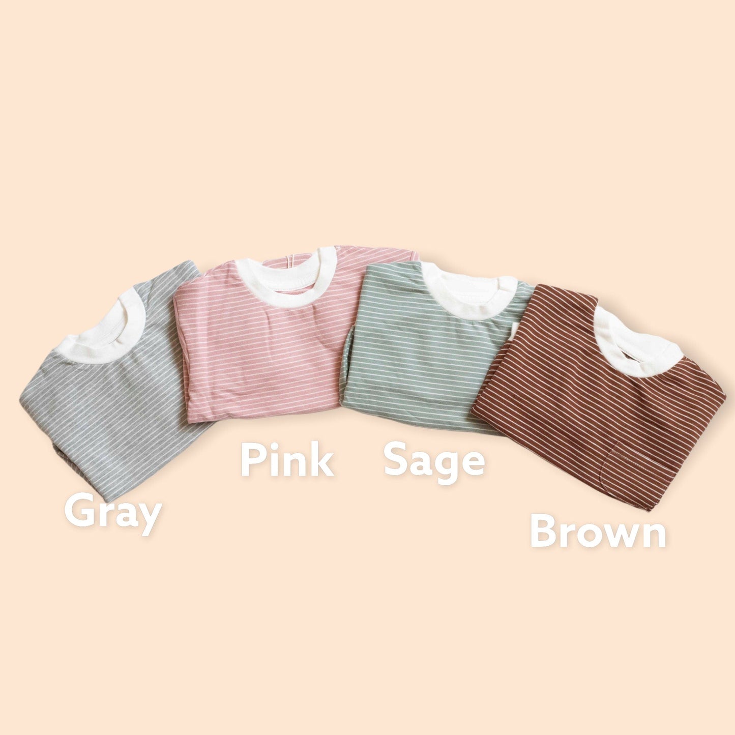 Four shirts in gray, pink, sage, and brown on a beige background with color labels.