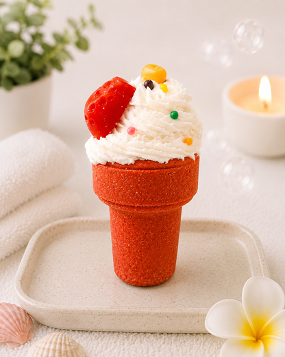 Decorative ice cream cone with whipped cream and berries on a white surface with a candle and flowers.