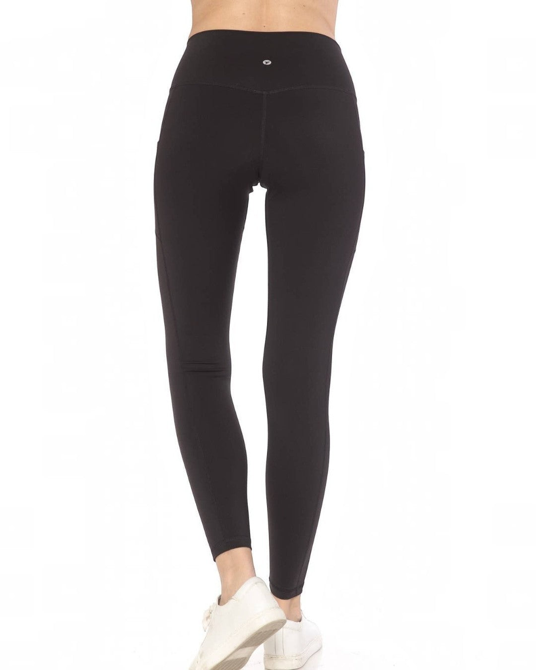 Black leggings worn by a person on a white background