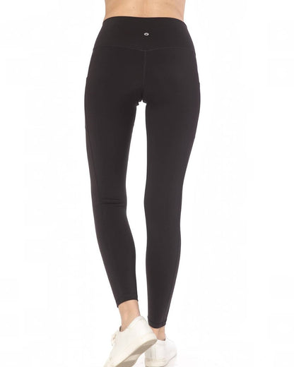 Black leggings worn by a person on a white background