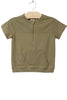 Green short-sleeve pullover with a pocket on a beige hanger against a white background